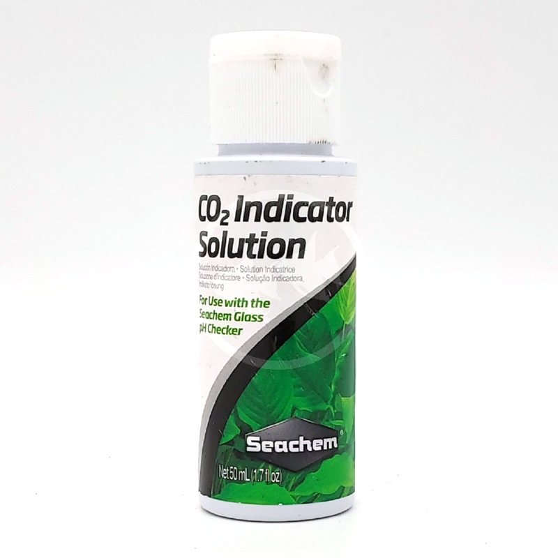 SEACHEM CO2 INDICATOR SOLUTION 50 ML FRONT.jpg A small white bottle labeled CO2 Indicator Solution by Seachem, featuring green leaves on the label and designed for use with Seachem glass pH checkers. The bottle contains 50 mL (1.7 fl oz) of solution.