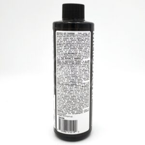 A black bottle with a black cap, shown from the back. The label is densely printed with white text containing directions, guidelines, and product information. A barcode is visible at the bottom of the label.