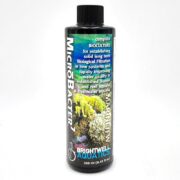 A 250 ml bottle of Brightwell Aquatics MicroBacter7 with a black cap. The label features underwater coral imagery and text describing it as a bioculture for biological filtration in aquariums.