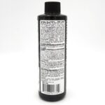 A black plastic bottle with a black cap, showing a white label covered in detailed instructions, guidelines, ingredients, and a barcode on the back. The text is small and densely packed on the label.