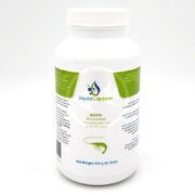 A white bottle of Liquid Gardens GH KH+ remineralizer, intended for use with RO/DI water. The label features green accents, text details, and a blue shrimp illustration. Net weight is 250g (8.18 oz).