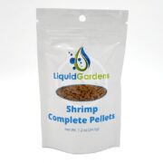 A white resealable pouch labeled Liquid Gardens Shrimp Complete Pellets with an image of brown pellets. The package shows the net weight as 1.2 oz (34.0g).