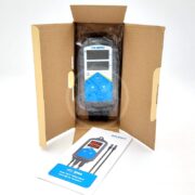 A digital INKBIRD ITC-306A temperature controller in an open cardboard box, with a user manual and probe cables placed beside it on a white surface.