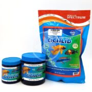 Three containers of NLS CICHLID PELLETS REG: two blue-lidded jars and one large resealable bag, each featuring images of colorful cichlid fish and detailed product labeling.
