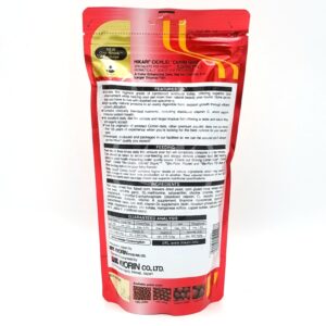 The back view of a HIKARI CICHLID GOLD LARGE FLOAT 8.8 OZ (250G) package displays product info, feeding instructions, ingredients, guaranteed analysis, and manufacturer details in black and white text on the red packaging.