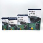 Four Aqueon QuietFlow E Internal Power Filter boxes in different sizes (extra small, small, medium, and large) are displayed in a row against a white background.