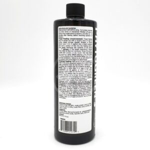 A black plastic bottle with a black cap, featuring a white label covered in dense black text. The label includes feeding instructions, guidelines, and ingredient information for a plant nutrient product.