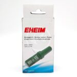 A white box with the brand name EHEIM in red text, displaying an image of a green plastic suction basket filter. The box includes product names in four languages and a blue wave design at the bottom.