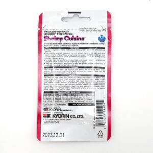 The HIKARI SHRIMP CUISINE 10 G (.35 OZ) package features a white and pink design, showing ingredients, feeding instructions, manufacturer info, barcode, and an expiration date of 2023.12.01 on the back.