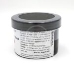 A small black plastic container labeled GS1 Brine Shrimp Eggs with instructions and storage information printed on the side. The lid is tightly closed, and a barcode is visible. The best by date is August 2026.