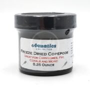 A small black container labeled Aquatics Unlimited Freeze Dried Copepods, Great for Carnivores, Fry, Corals and More! 0.25 Ounce is shown against a white background.