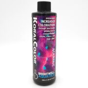 A bottle of Brightwell Aquatics Koral Color Marine, a 250 ml (8.45 fl oz) aquarium supplement, with text promoting increased coloration for corals, clams, and their allies. The label features a coral background image.