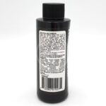 A black plastic bottle with a black cap, featuring a white label with detailed instructions, guidelines, and ingredient information printed in small text on the back. A barcode is visible at the bottom of the label.