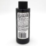 A black plastic bottle with a ribbed black cap, displaying a white label with barcode and detailed usage and caution instructions for an aquarium product. The text is small and mostly covers the back of the bottle.
