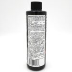 Black bottle with a black cap, featuring a detailed label of white text containing instructions, guidelines, and product information. The text is small and densely packed, making it difficult to read in this image.