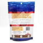 The back of a NorthFin Cichlid fish food bag. The packaging is blue and white with feeding instructions, nutritional information, and a barcode. The text is mostly in English and French.