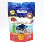 A package of NorthFin Cichlid Formula premium fish food, featuring images of colorful fish, product details in English and French, and a red “Quality Guarantee Seal.” The package contains 250g (8.8 oz) of fish food.