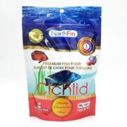 A package of NorthFin Cichlid Formula premium fish food, featuring images of colorful fish, product details in English and French, and a red “Quality Guarantee Seal.” The package contains 250g (8.8 oz) of fish food.