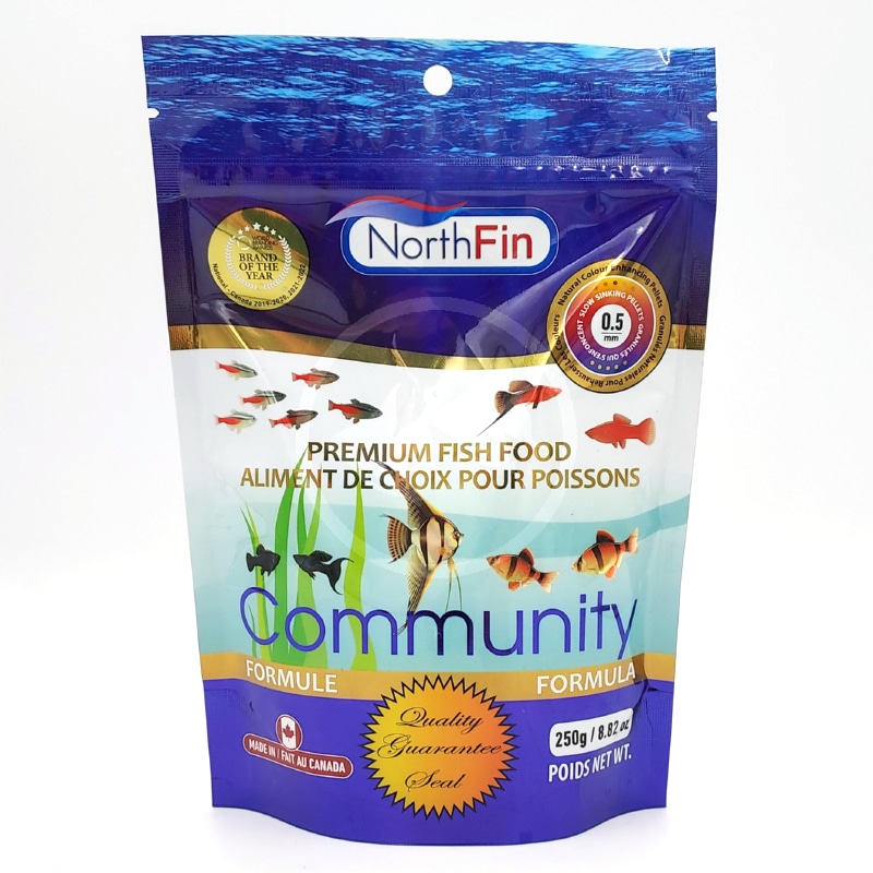 NORTH FIN COMMUNITY FORMULA 5 MM FRONT.jpg A blue and white pouch of NorthFin Premium Fish Food, Community Formula, featuring images of various fish, a gold seal, and bilingual English and French text. The package weighs 250g (8.8oz).