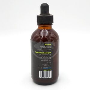 A brown glass dropper bottle with a black cap, showing a label on the back that lists storage instructions, a guaranteed analysis, and a Made in Canada note. The background is white.