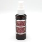 A brown plastic spray bottle with a white cap and detailed instructions printed on the label. The bottle is photographed against a plain white background.