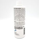 A white plastic bottle with a white cap, labeled with black text describing its use for aquarium coral care. The label includes directions, warnings, and manufacturer details. The front text is partially visible.