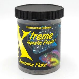A container of Xtreme Aquatic Foods Spirulina Flake, featuring images of colorful fish on a black label, with a black screw-on lid and yellow and white text.
