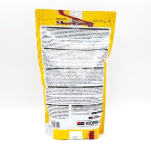 A yellow and white resealable package of HIKARI SILKWORM SELECTS TREAT 17.6 OZ is shown from the back, featuring detailed product information, instructions, and branding in black and red text.