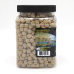 A plastic container with a black lid filled with fish pellets.