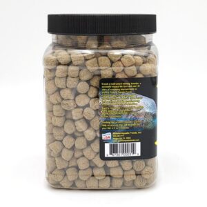 A plastic container with a black lid filled with fish pellets.