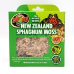 A green box of Zoo Med New Zealand Sphagnum Moss with a clear window showing the moss inside. The packaging features an image of a frog and text highlighting it as all natural and dye-free.