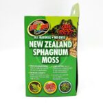 A green box of Zoo Med New Zealand Sphagnum Moss featuring images of a frog, moss, and terrariums. The box advertises all-natural, dye-free moss for habitat humidity and animal terrariums.