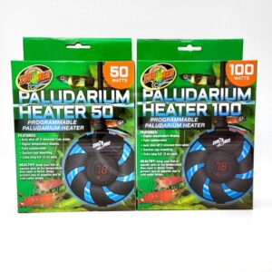 Two boxes of Zoo Med Paludarium Heaters are displayed side by side. The left box is 50 watts and the right box is 100 watts. Both feature images of the heaters and have green and orange accents with animal images.