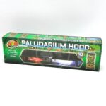 A green box labeled Paludarium Hood from Zoo Med, suitable for 18-inch setups, designed for use with UVB, 24-hour heat, or daylight lamps. Images of terrariums and reptiles decorate the packaging.