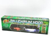 A green box labeled Paludarium Hood from Zoo Med, suitable for 18-inch setups, designed for use with UVB, 24-hour heat, or daylight lamps. Images of terrariums and reptiles decorate the packaging.