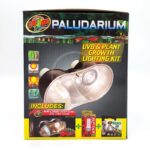Front of a Zoo Med Paludarium lighting kit box showing the lamp, packaging details, icons for tropical, daylight, and plant growth features, and included items: a dual lamp fixture, ReptiSun bulb, and Nano LED.