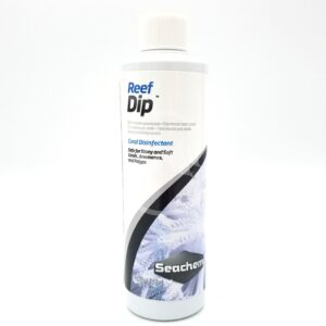 SEACHEM REEF DIP 250ML (8.5 OZ) comes in a white plastic bottle with a white cap and blue-black label featuring coral imagery. This coral disinfectant helps protect your corals from harmful bacteria.