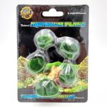 A package labeled UT MINI MOSS ROCK 5 PK contains five round artificial green moss balls for aquarium decoration, displayed in clear plastic on cardboard backing with an underwater landscape image.