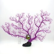 The UT SEA FAN PURPLE artificial coral is mounted on a black base and displayed against a white background. A ruler beside it shows the scale, and a colorful label is attached near the center.