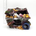 The PP RESIN TREASURE CHEST is a decorative aquarium ornament shaped like a broken chest, adorned with faux moss, gold and silver coins, and gems, shown with a ruler in the background for scale.