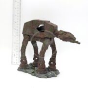 The UT RESIN SPACE BATTLE TANK MD model stands on a rocky base beside a ruler, measuring about 13 cm tall. The weathered model is dark green-brown, resembling a Star Wars space battle tank.