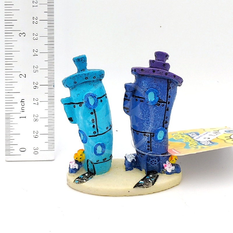 20221013_152710DONE.jpg Two small blue and purple house figurines from PP RESIN SPONGEBOB BIKINI BOTTOM HOMES SBR61 sit on a round base with mini coral and sea plants, next to a ruler showing they are about 3 inches tall.
