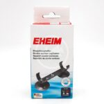 A white box with red EHEIM branding displays the EHEIM 7443900 JAGER HEATER HOLDER, a double suction cup holder for aquariums. The front features a product image and multilingual text describing its use.