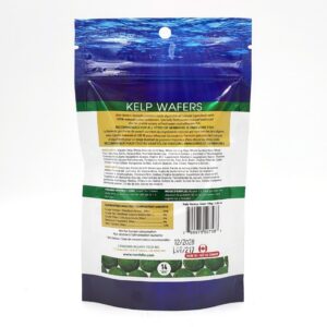 A package of kelp wafers for fish, shown from the back. The label includes product information, feeding instructions, nutritional analysis, and company details. The top of the package features an underwater ocean design.