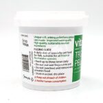 White container of aquatic fish food with a green and white label displaying feeding instructions, warnings, and product information, including Not for human consumption in red text. A barcode and recycling symbol are also visible.