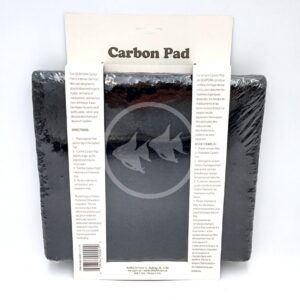 The SEAPORA PAD CARBON 10"X18" package contains two black rectangular pads wrapped in plastic, with a white label showing product details and instructions, plus a logo of two fish.