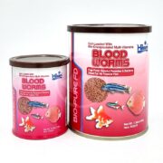 Two HIKARI FREEZE DRIED BLOOD WORMS containers with pink labels, fish and blood worms images, vitamin benefits for tropical fish. The two containers are different sizes and placed side by side.