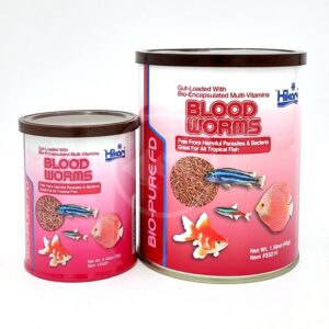 Two HIKARI FREEZE DRIED BLOOD WORMS containers with pink labels, fish and blood worms images, vitamin benefits for tropical fish. The two containers are different sizes and placed side by side.