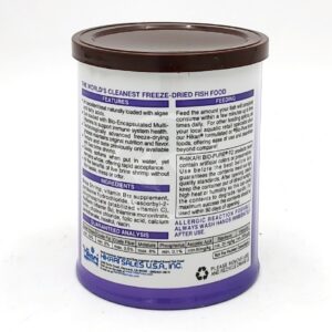 A cylindrical container with a brown lid and purple base displays detailed text about HIKARI FREEZE DRIED BRINE SHRIMP .42 OZ (12G), including features, ingredients, feeding instructions, and regulatory information.