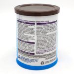 A canister of HIKARI FREEZE DRIED SPIRULINA BRINE SHRIMP .42 OZ (12G) fish food with a brown lid features product details in black text on a white and purple label, including ingredients, feeding instructions, and contact info.
